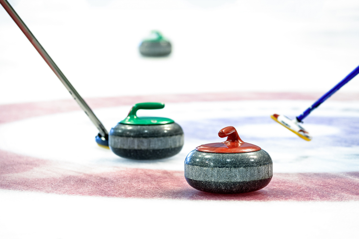 Curling stones on the ice.